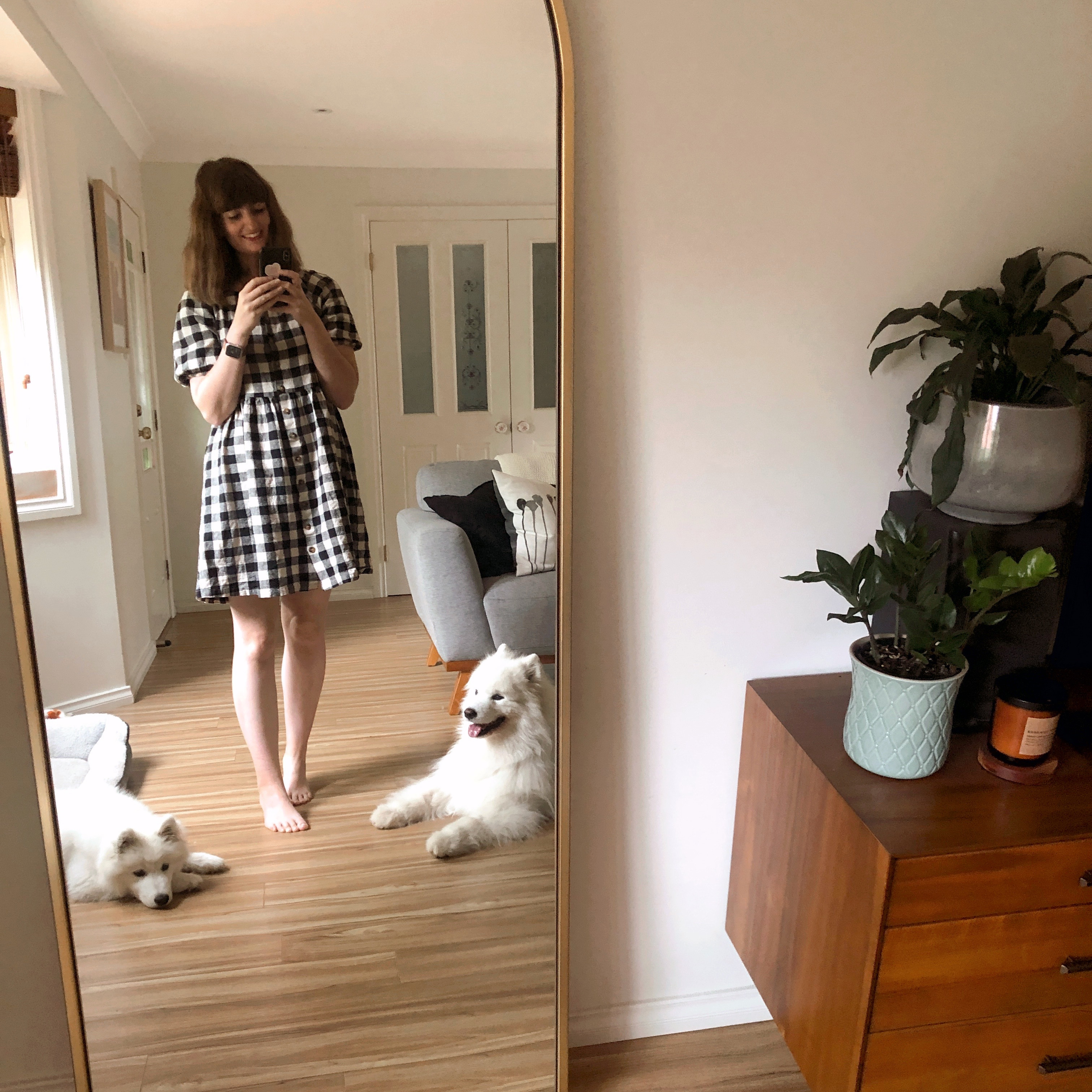 Photo of Taryn with her two samoyed dogs
